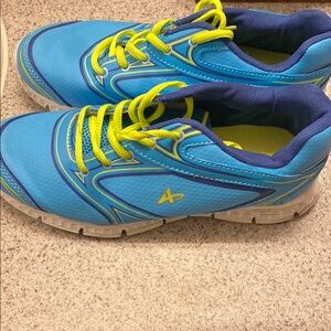 Blue and Yellow Sneakers with Neon Laces and Modern Design